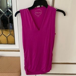 Women’s beautiful Pink sleeveless Tee thats Ruched on both sides at the bottom.